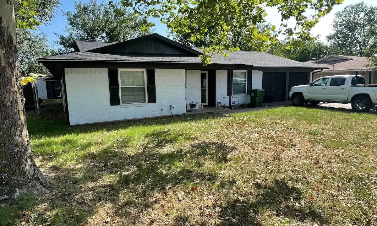 Professional roofing crew working on a residential roof in Sandwich
